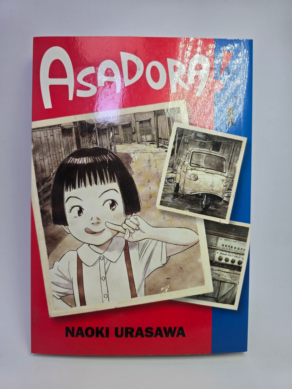 Asadora Vol 1 manga knygos viršelis su Naoki Urasawa piešta mergaite   