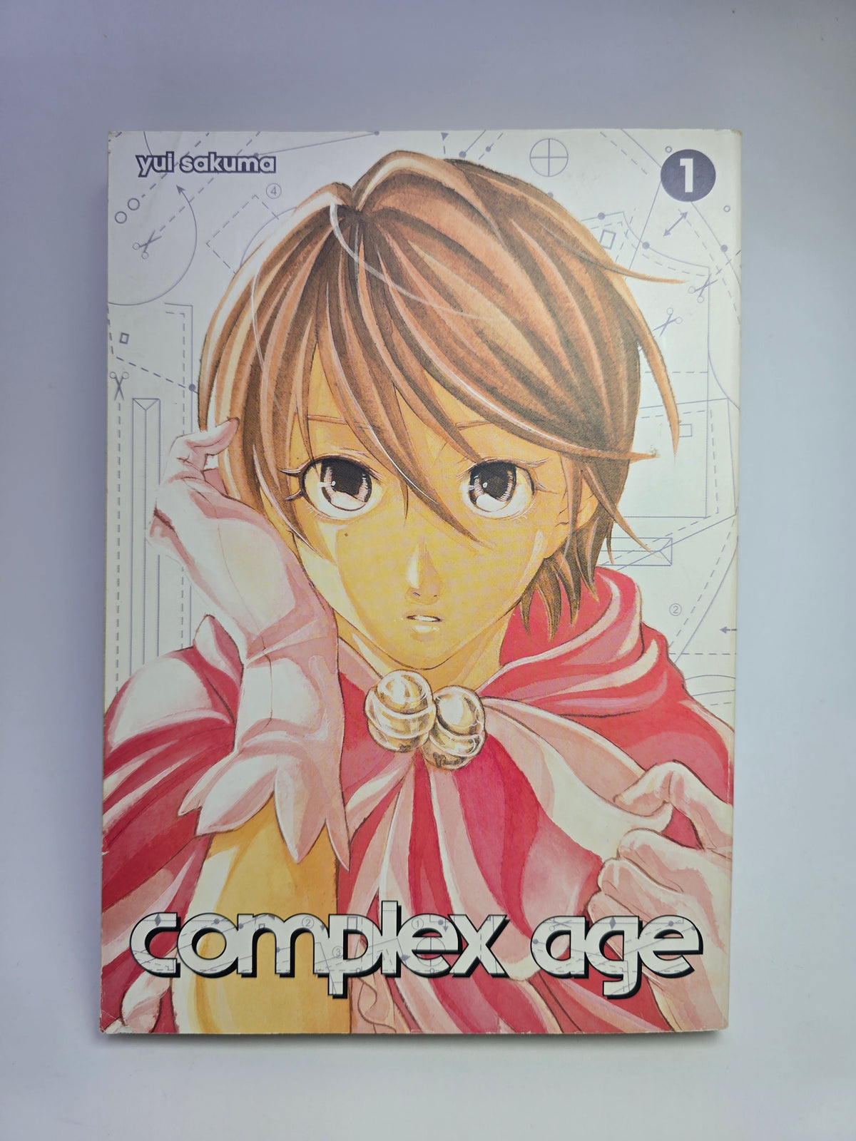 Complex Age Vol 1 manga viršelis su Yui Sakuma iliustracija   