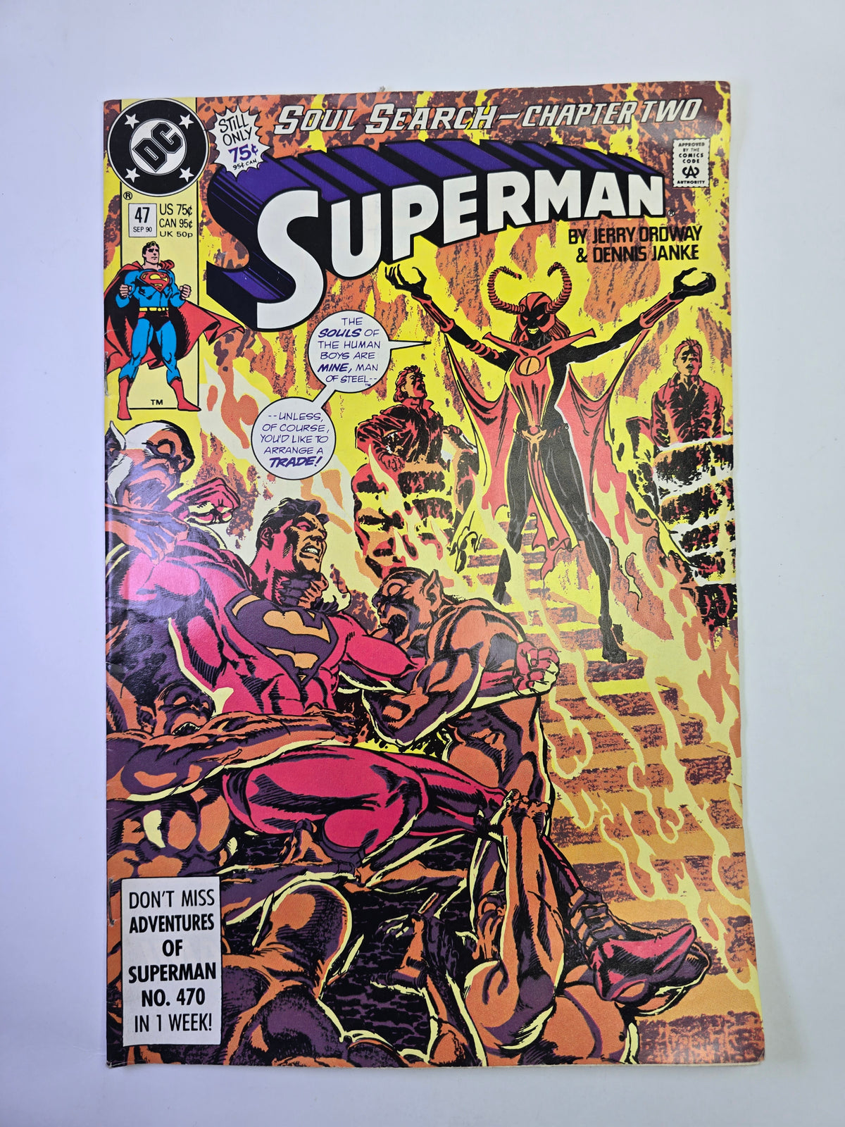 Superman #47 DC Comics komikso viršelis su Supermeno ir demonų kova ugnies fone