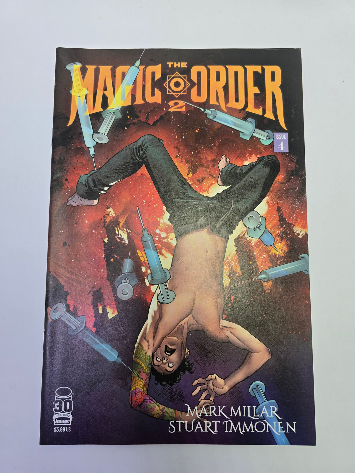 The Magic Order 2 #4 Image Comics komikso viršelis su Mark Millar ir Stuart Immonen pavardėmis   