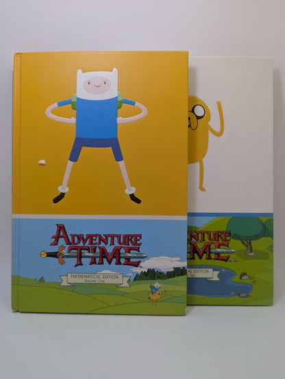 Grafinės novelės Adventure Time: Mathematical Edition Vol. 1–2 viršeliai su animacinio serialo personažais.