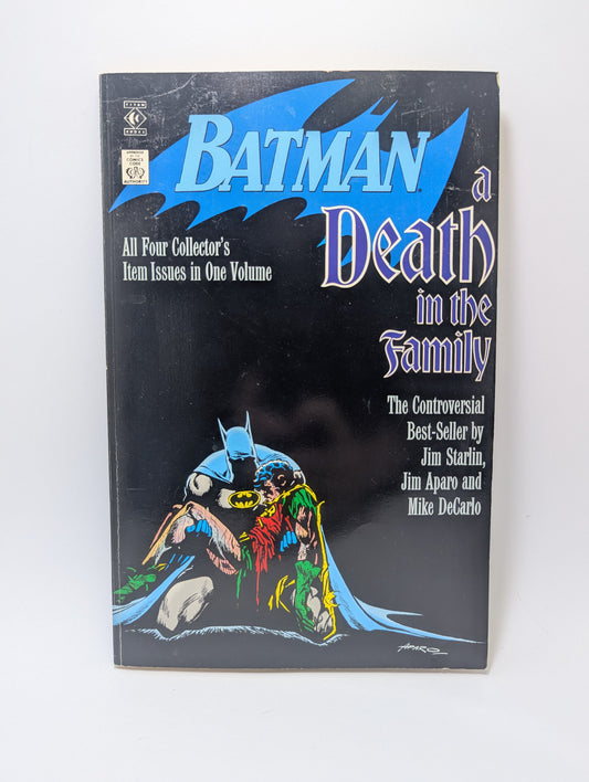Grafinės novelės Batman: Death in the Family viršelis su tragiška Betmeno ir Robino scena.