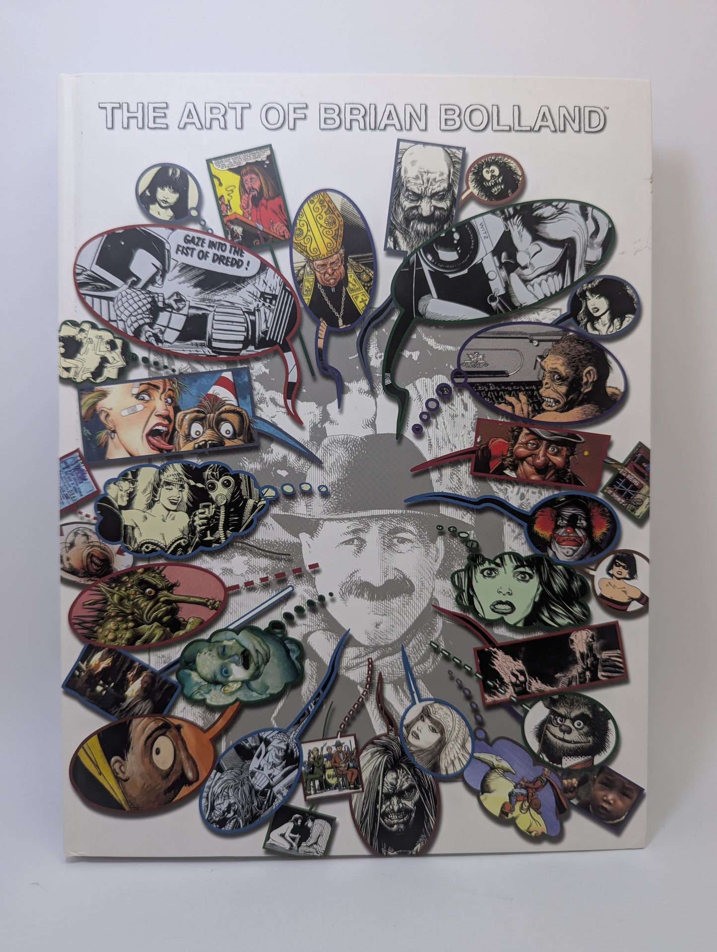 Meno knygos The Art of Brian Bolland viršelis su komiksų iliustracijomis ir piešinių detalėmis.