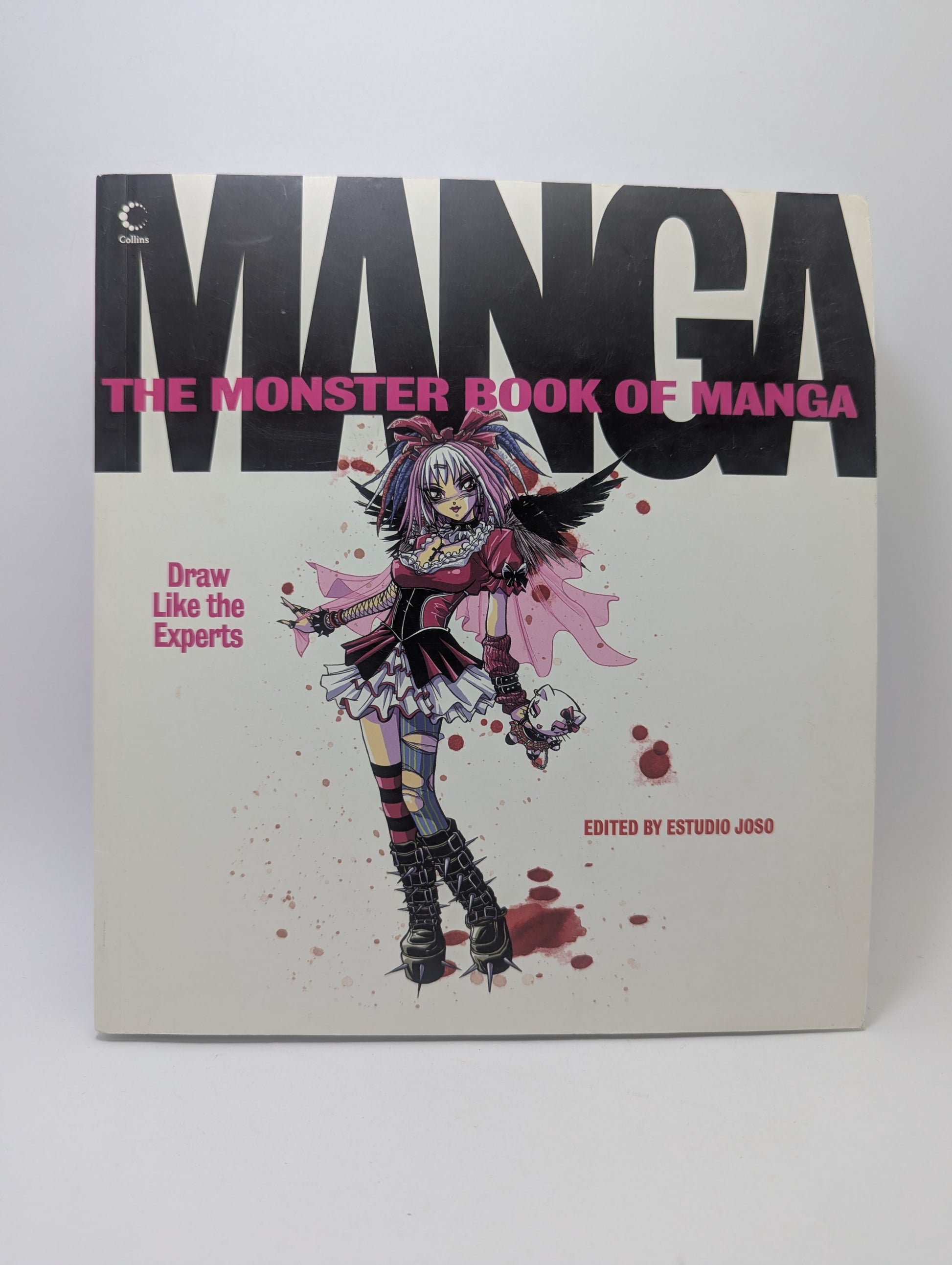 Anglų kalba išleista knyga „The Monster Book of Manga: Draw Like the Experts“ su iliustruotu viršeliu, skirta mokytis piešti manga stiliumi.