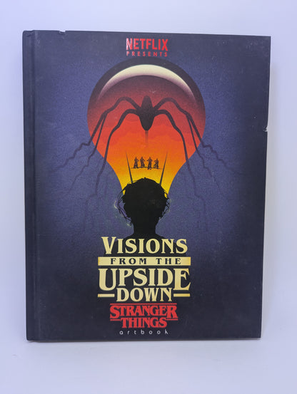 Meno knygos Visions from the Upside Down: Stranger Things viršelis su serialo konceptinio meno iliustracijomis.